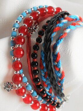 Handmade bracelet with rows of threads, beads, and charms No.234